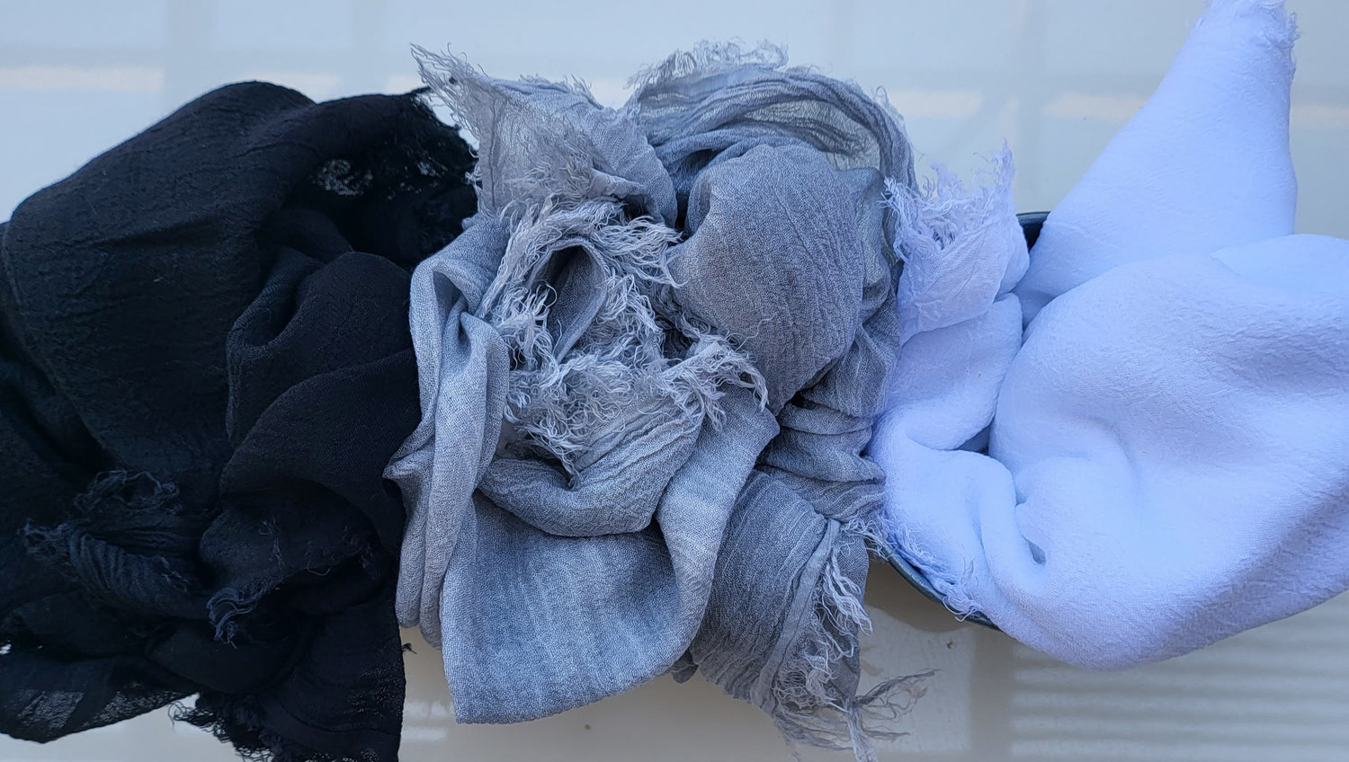 black, grey. white scarfs