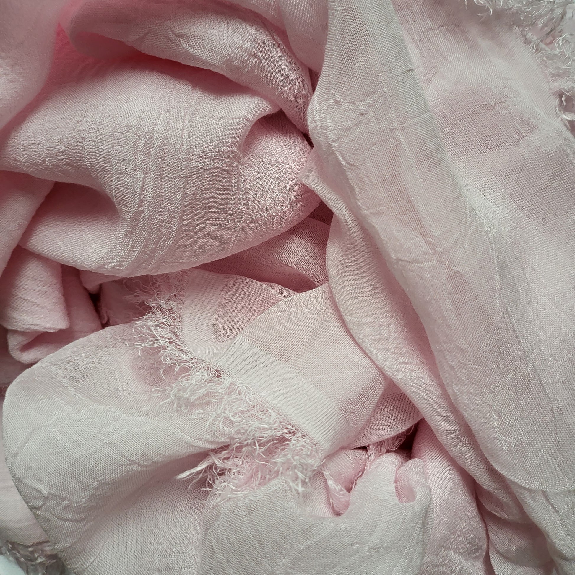 Pink bamboo stole with a soft British rose-inspired hue, showcasing a delicate and elegant design